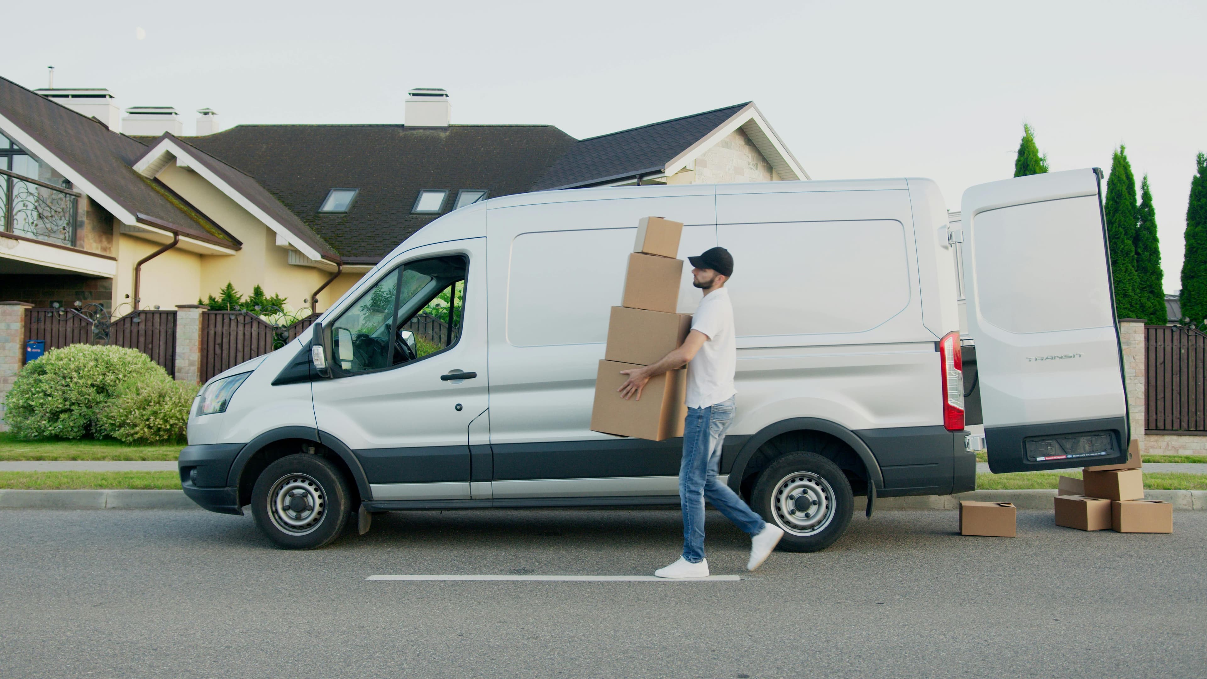 Delivery trucks from USPS, UPS, and FedEx lined up for comparison