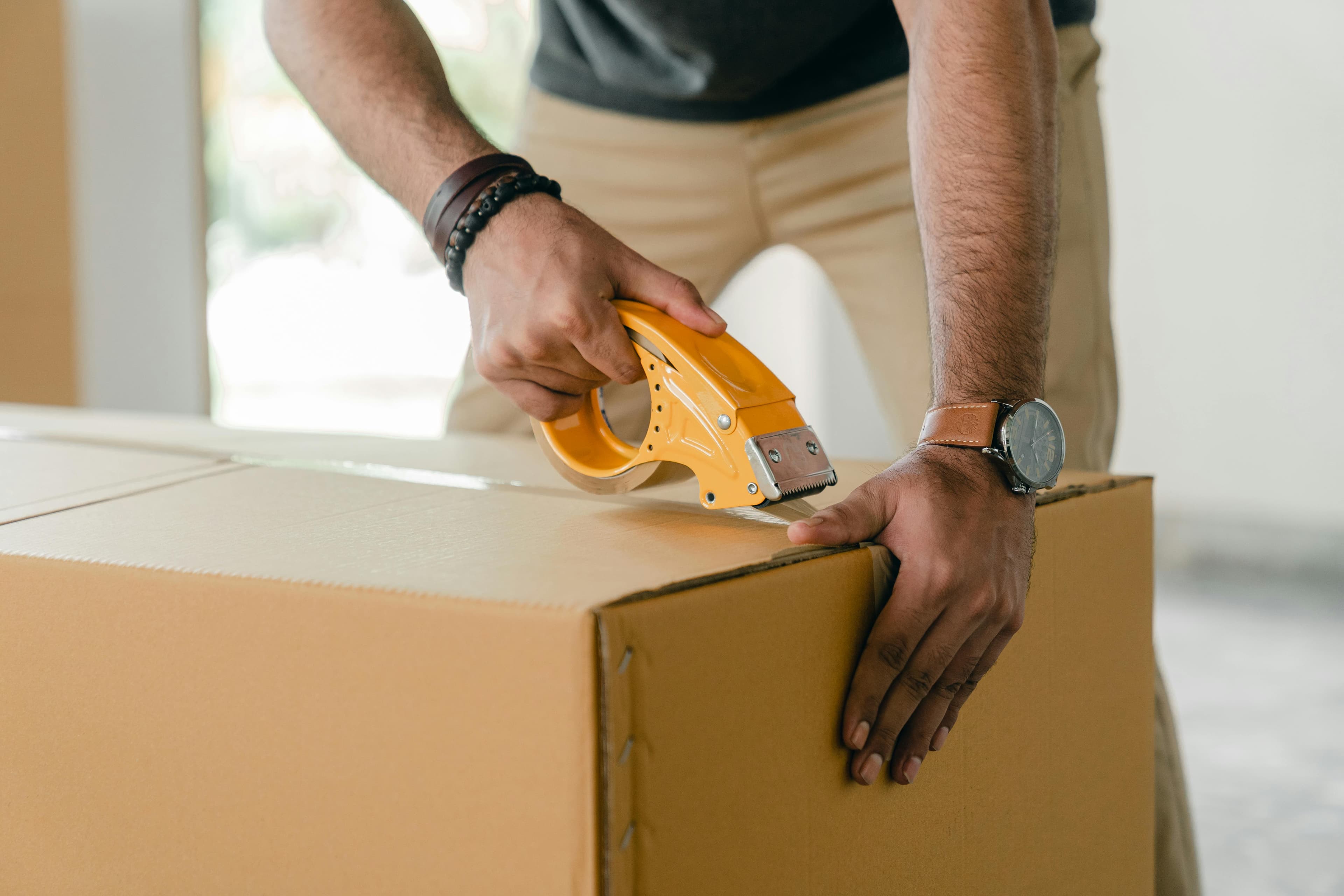 Return shipping label on a package with Shopify store return policy document